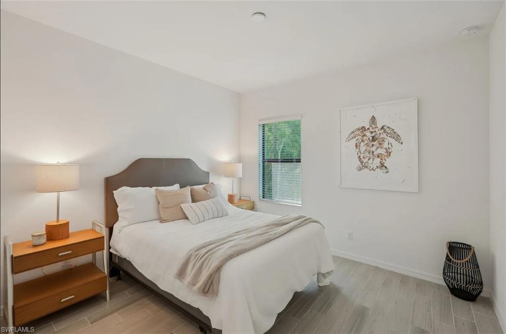 3029 Juniper Way Naples, FL 34112 - Photo 11 of 20 Bedroom featuring wood tiled floors