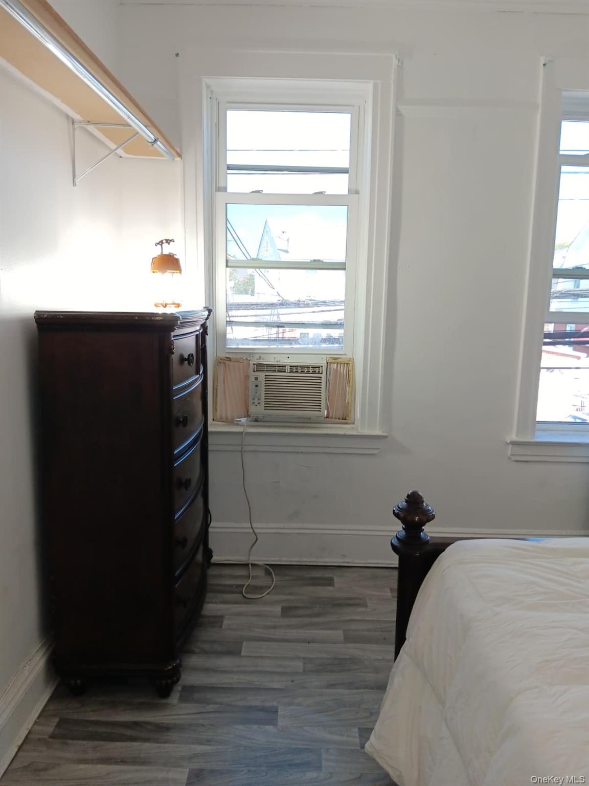91-08 Sutter Avenue Queens, NY 11417 - Photo 12 of 32 Bedroom with dark wood-style flooring and cooling unit