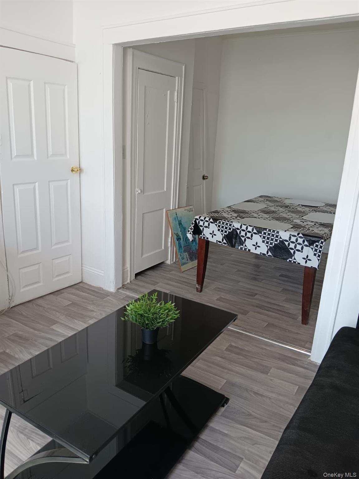 91-08 Sutter Avenue Queens, NY 11417 - Photo 21 of 32 Dining area featuring light wood finished floors