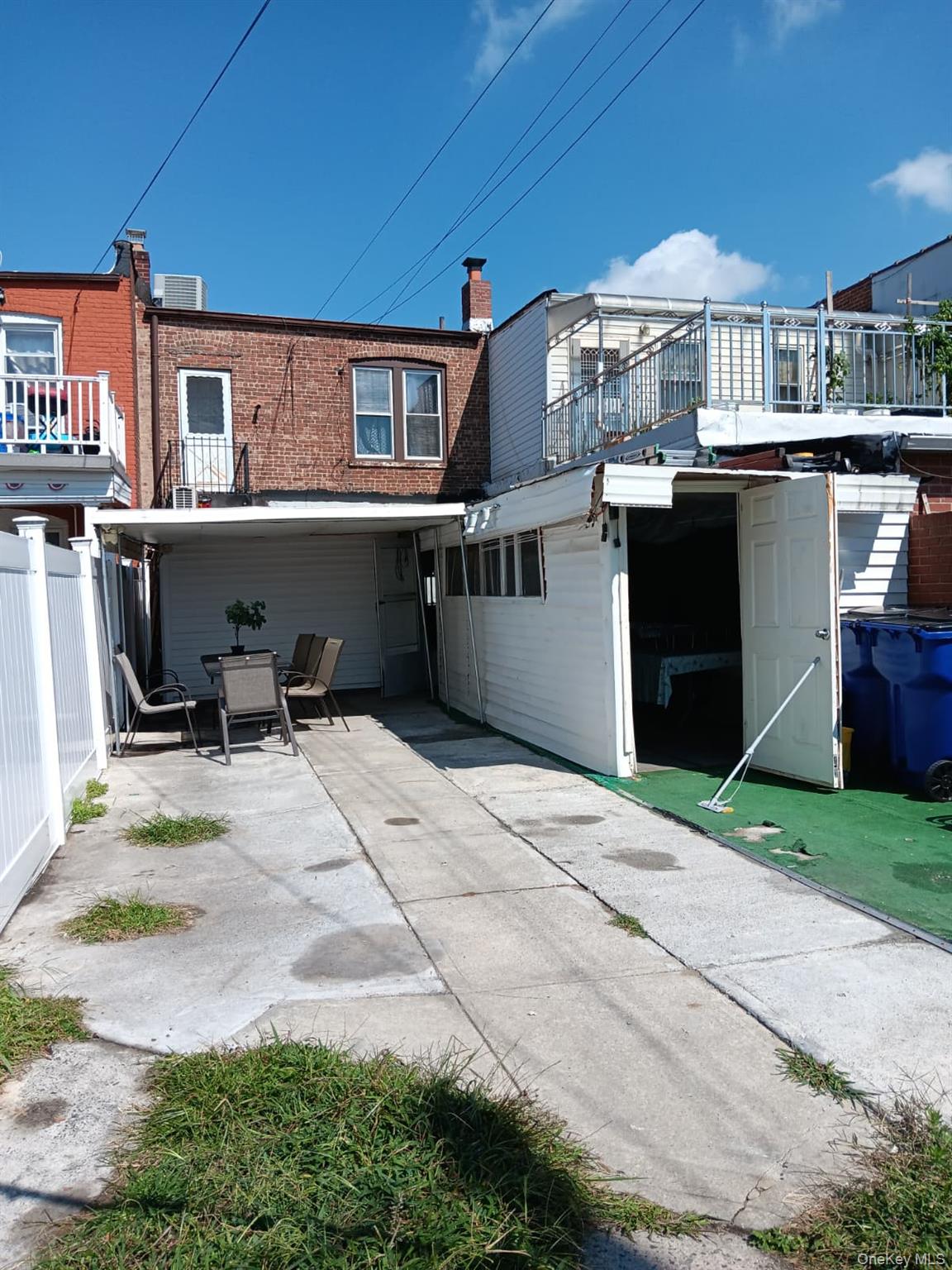 91-08 Sutter Avenue Queens, NY 11417 - Photo 22 of 32 Rear view of house featuring a patio