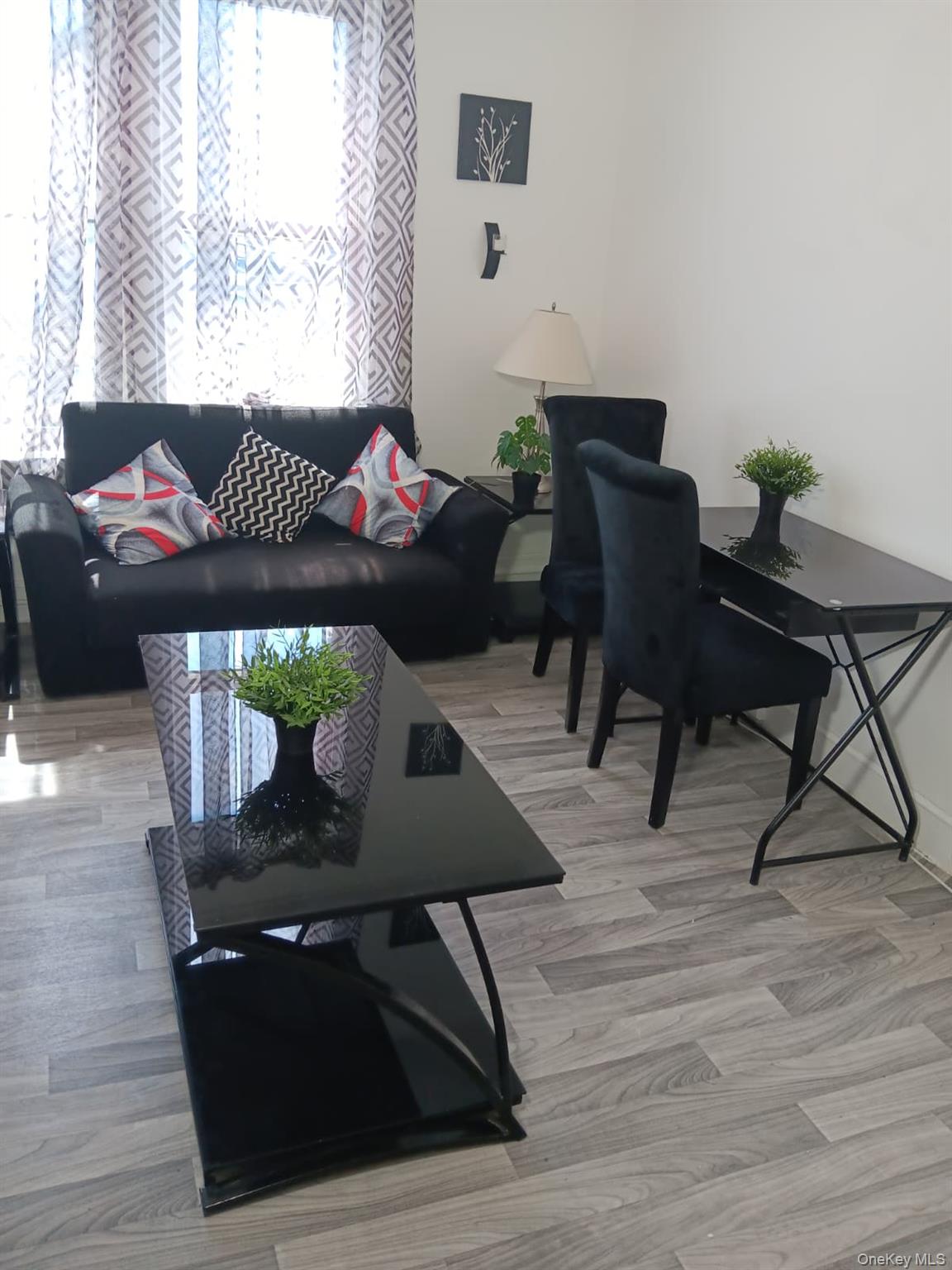 91-08 Sutter Avenue Queens, NY 11417 - Photo 4 of 32 Living area featuring light wood-style flooring