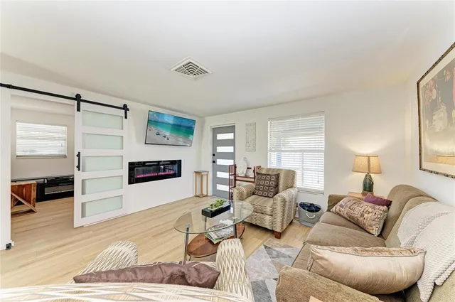 a living room with furniture and a window