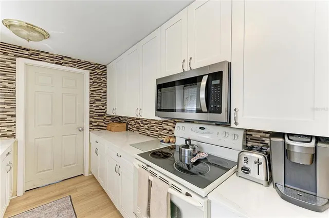 a bathroom with a sink and a washing machine