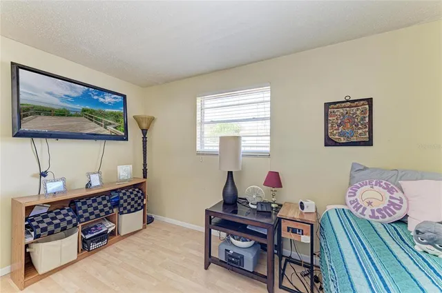 a bedroom with furniture and a window