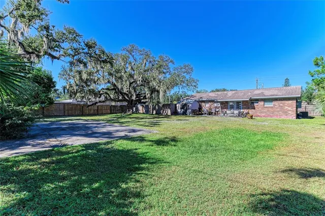 a view of a house with a big yard