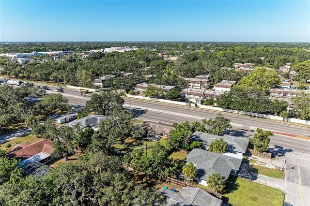 an aerial view of a house with a yard