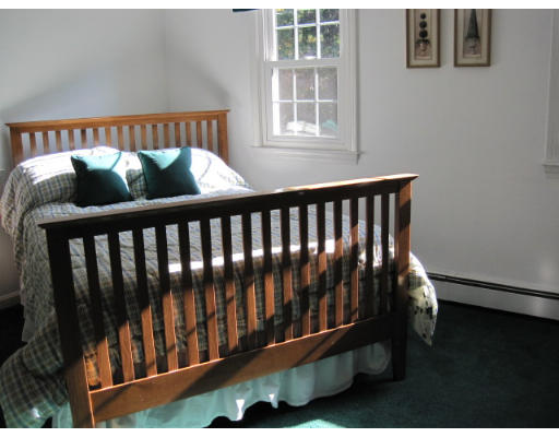 20 Pinewood Road Chelmsford, MA 01824 - Photo 11 of 15 a bed sitting in a bedroom next to a window