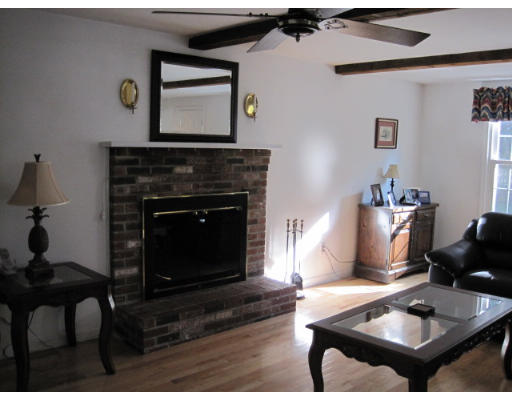 20 Pinewood Road Chelmsford, MA 01824 - Photo 7 of 15 a living room with furniture and a fireplace