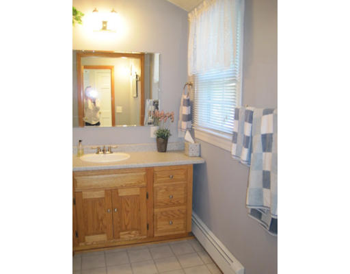 20 Pinewood Road Chelmsford, MA 01824 - Photo 9 of 15 a bathroom with a sink a mirror and a bathtub