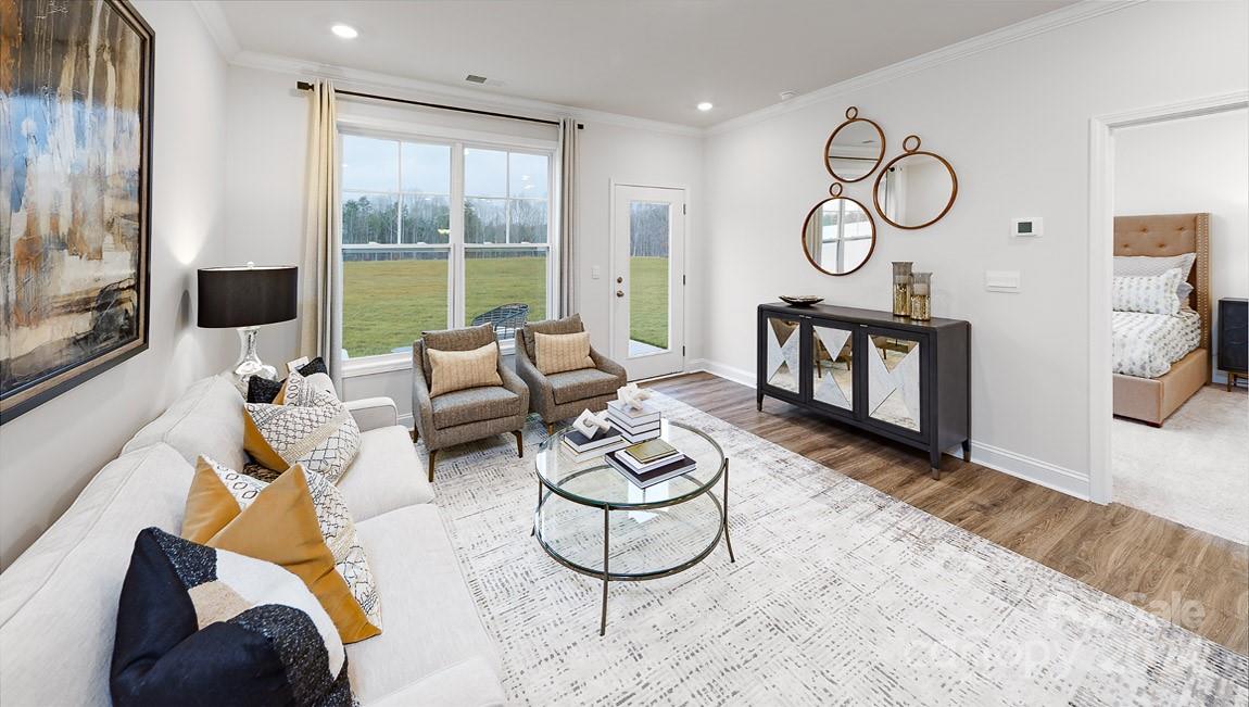 7870 Iron Road Sherrills Ford, NC 28673 - Photo 12 of 39 a living room with furniture wooden floor and a large window