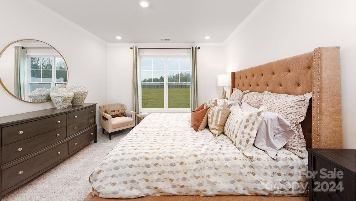 7870 Iron Road Sherrills Ford, NC 28673 - Photo 14 of 39 a bedroom with a large bed and a window