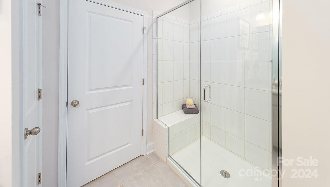 7870 Iron Road Sherrills Ford, NC 28673 - Photo 17 of 39 a bathroom with a glass shower door