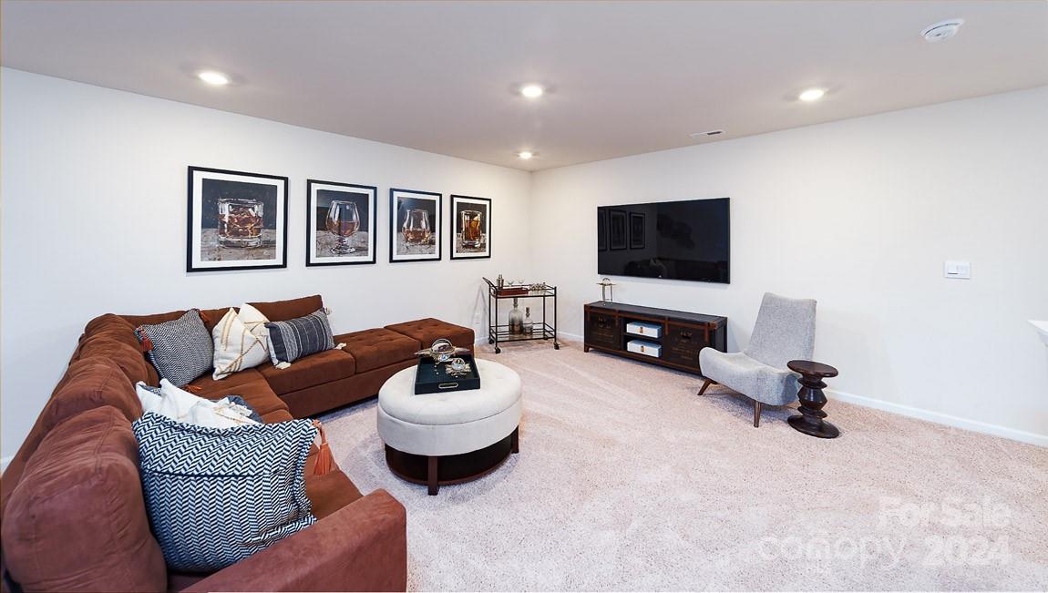 7870 Iron Road Sherrills Ford, NC 28673 - Photo 19 of 39 a living room with furniture and a flat screen tv