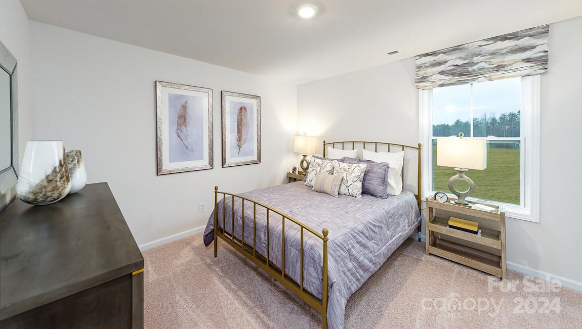 7870 Iron Road Sherrills Ford, NC 28673 - Photo 23 of 39 a bedroom with a bed and window