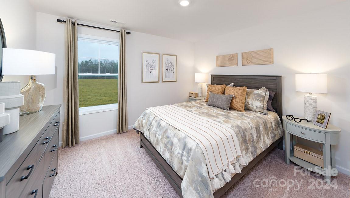 7870 Iron Road Sherrills Ford, NC 28673 - Photo 28 of 39 a bedroom with a bed and a lamp