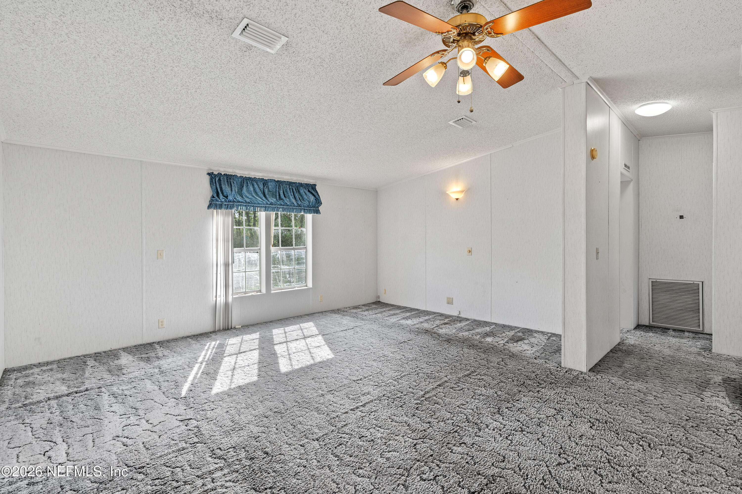 75026 Semper Fi Drive Yulee, FL 32097 - Photo 14 of 43 a view of an empty room with a window