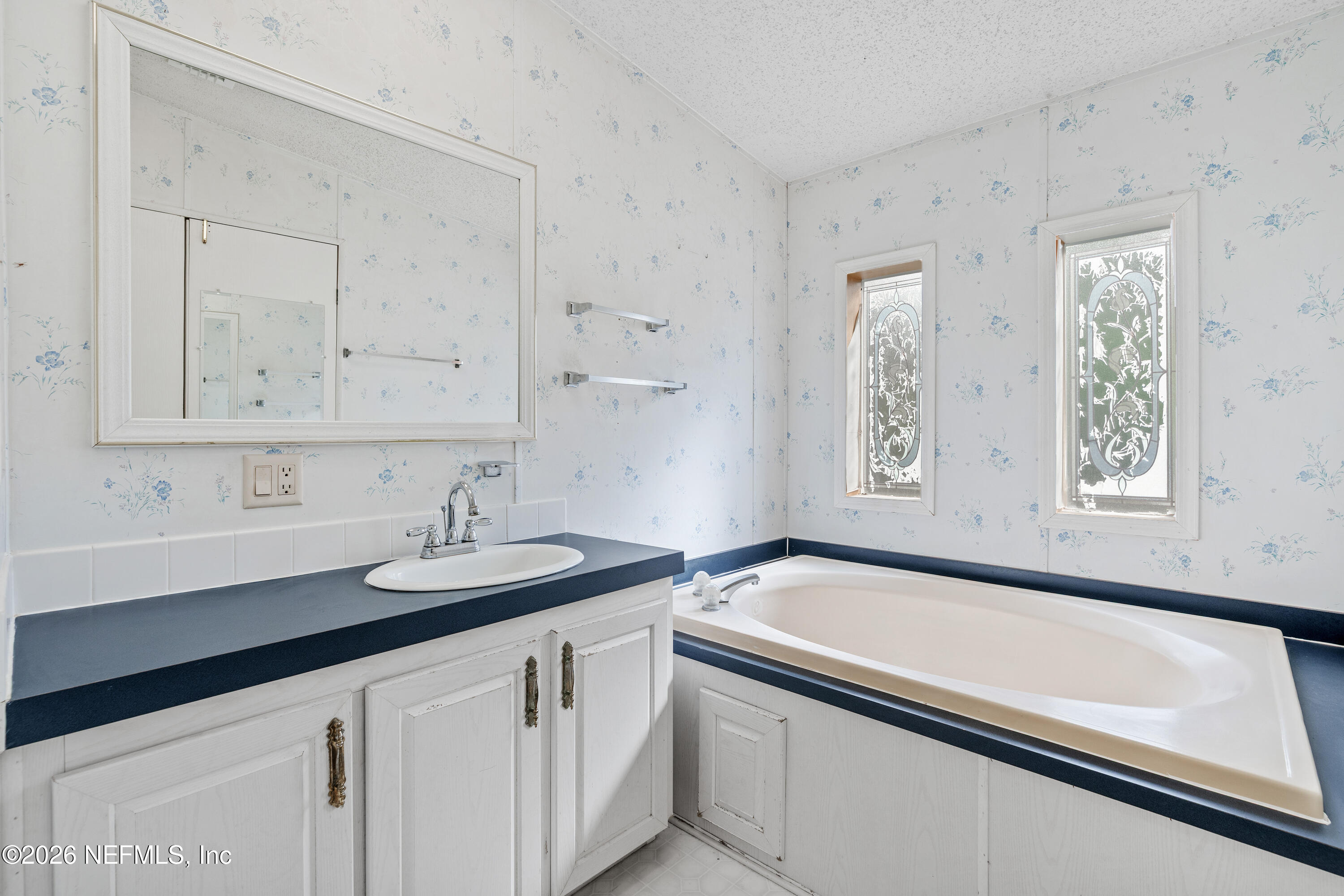 75026 Semper Fi Drive Yulee, FL 32097 - Photo 23 of 43 a bathroom with a sink and a bathtub