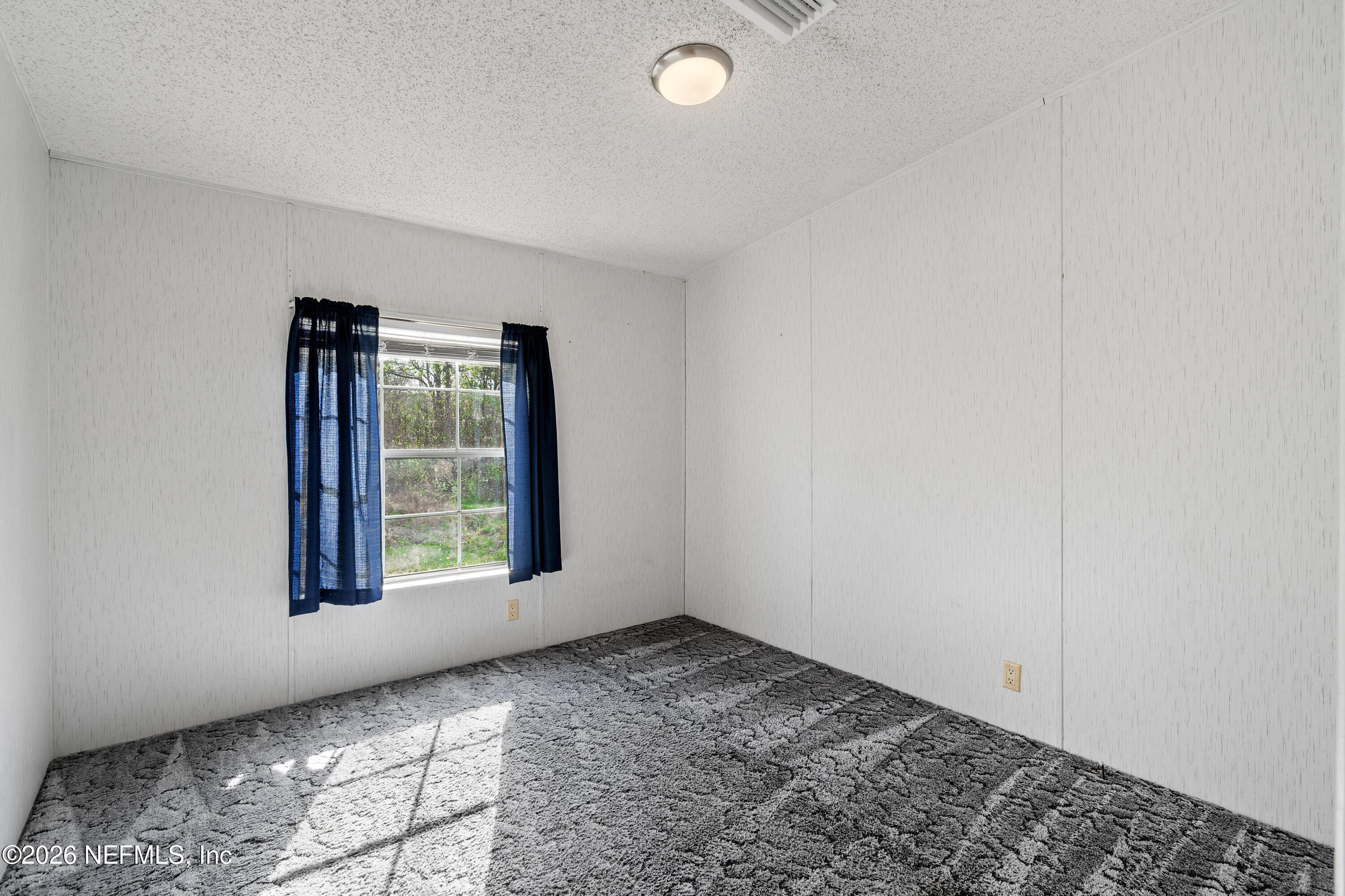 75026 Semper Fi Drive Yulee, FL 32097 - Photo 25 of 43 an empty room with windows