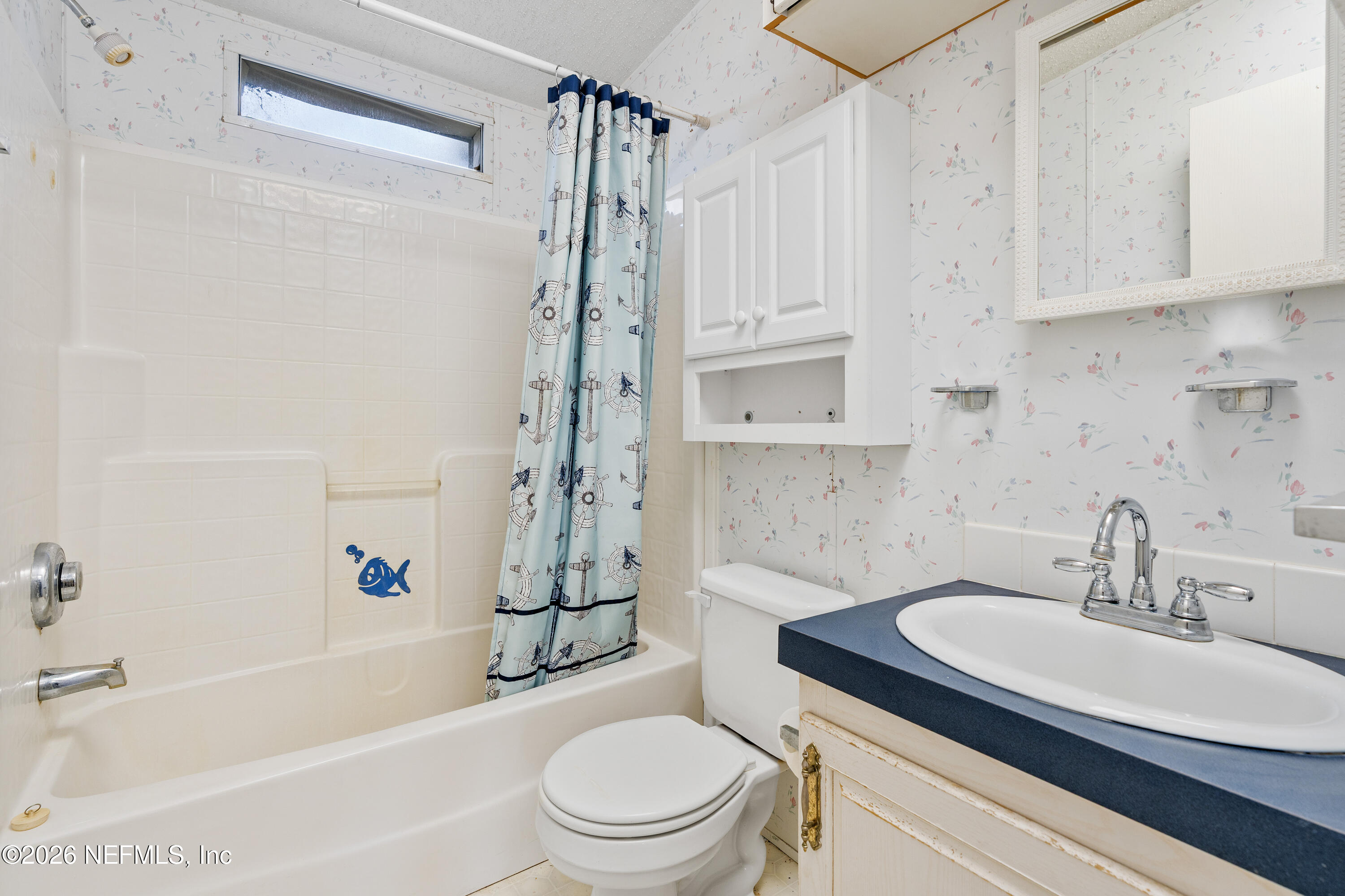 75026 Semper Fi Drive Yulee, FL 32097 - Photo 27 of 43 a bathroom with a sink toilet and shower