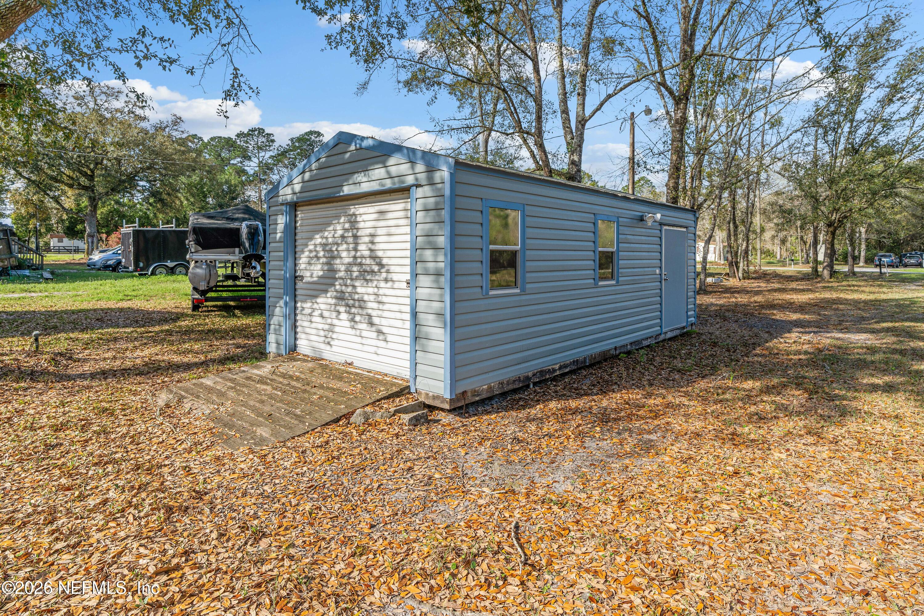 75026 Semper Fi Drive Yulee, FL 32097 - Photo 30 of 43 a view of a house with a yard