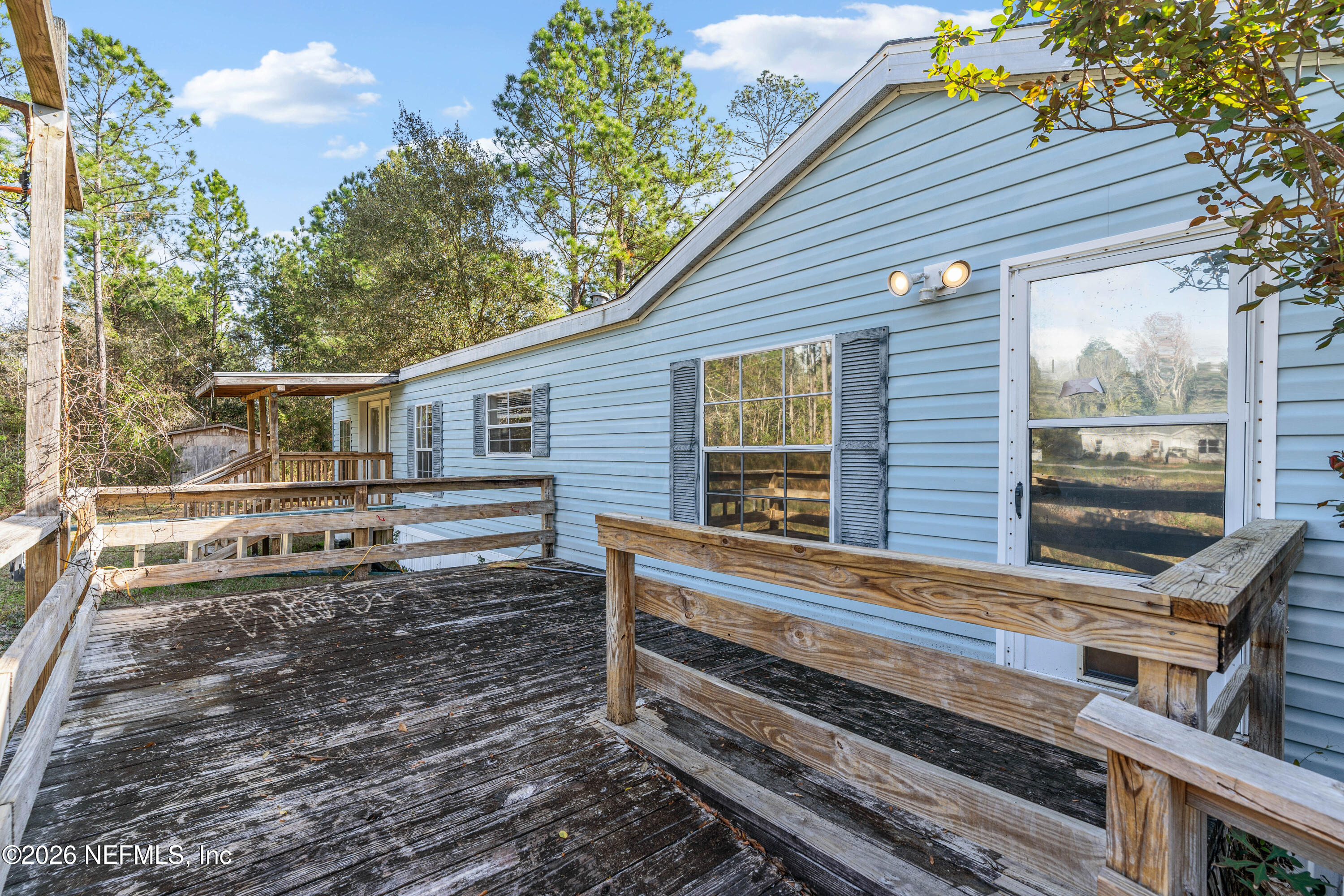 75026 Semper Fi Drive Yulee, FL 32097 - Photo 3 of 43 a front view of a house with a yard