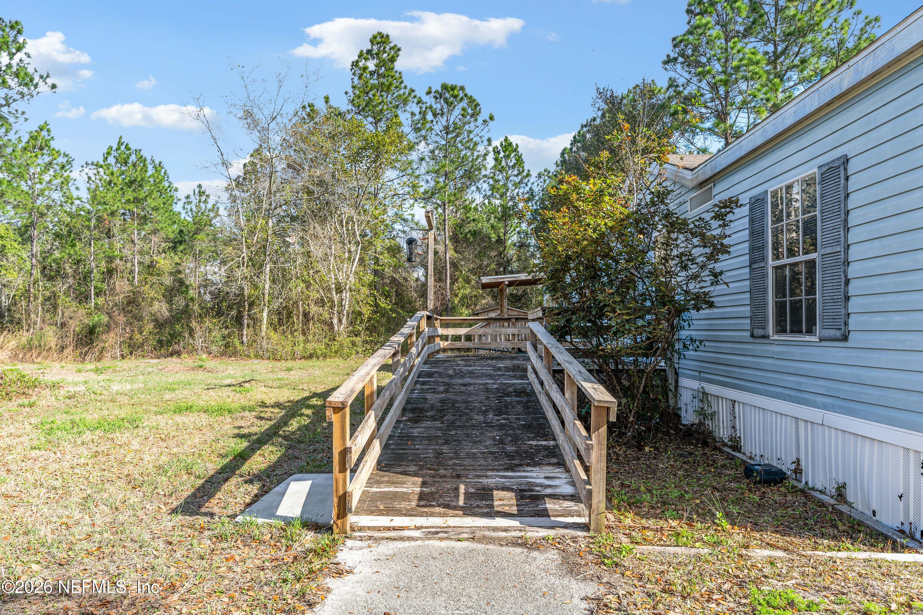 75026 Semper Fi Drive Yulee, FL 32097 - Photo 32 of 43 a view of a house with backyard