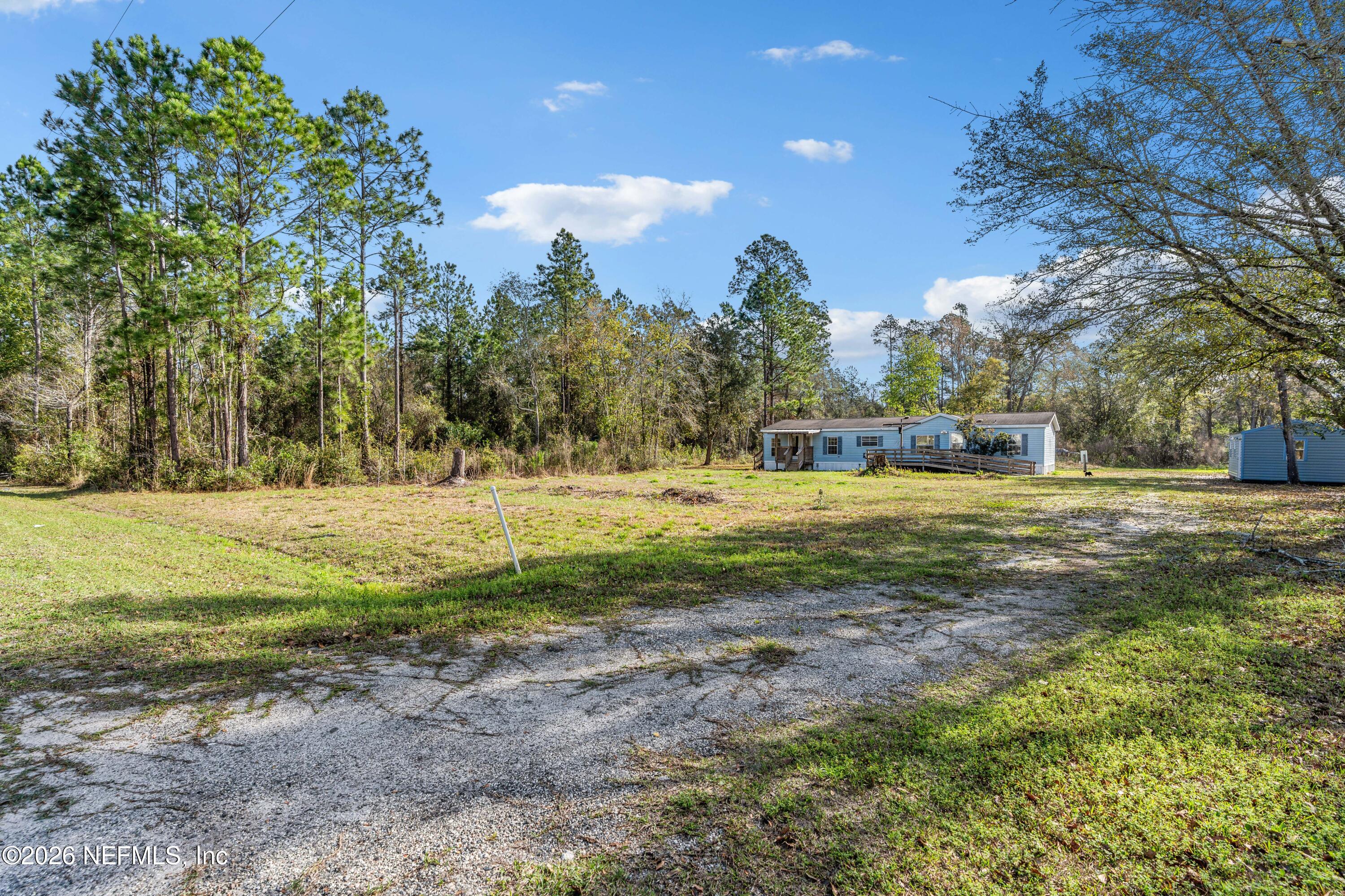 75026 Semper Fi Drive Yulee, FL 32097 - Photo 42 of 43 a view of yard with tree s