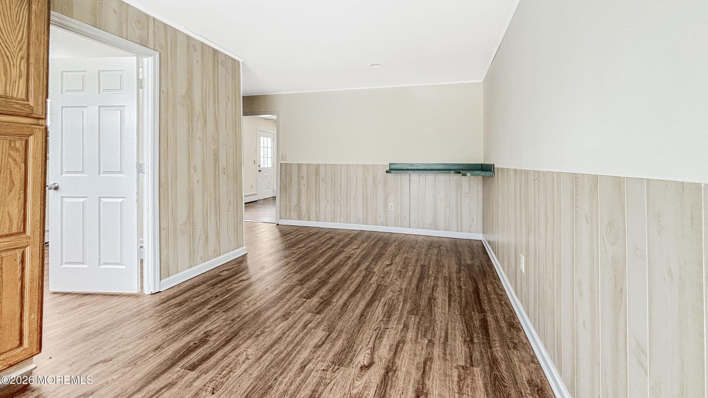385 Delaware Drive Brick, NJ 08723 - Photo 12 of 16 a view of wooden floor in an empty room