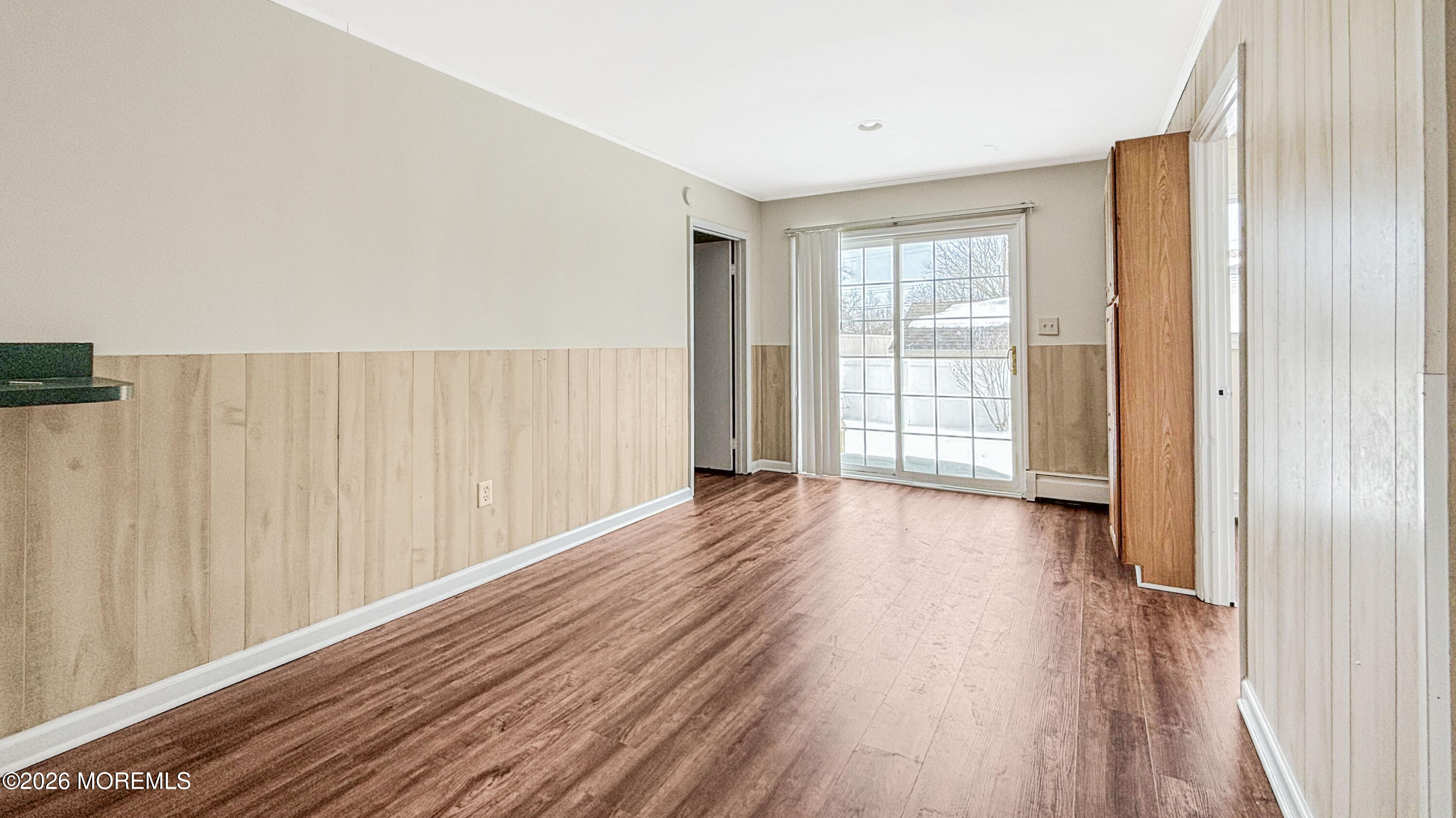 385 Delaware Drive Brick, NJ 08723 - Photo 13 of 16 a view of a big room with wooden floor and windows