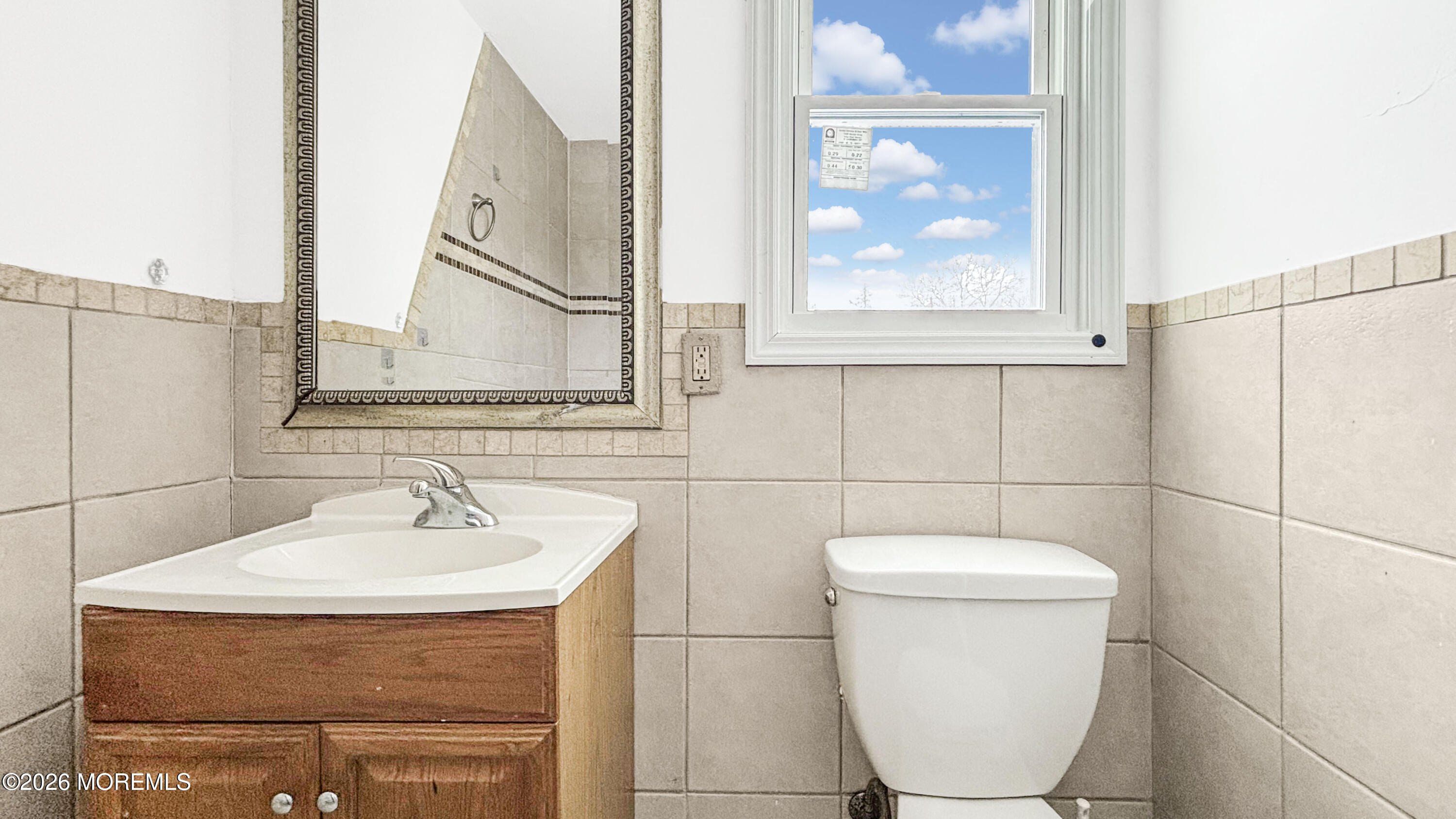 385 Delaware Drive Brick, NJ 08723 - Photo 15 of 16 a bathroom with a sink and mirror