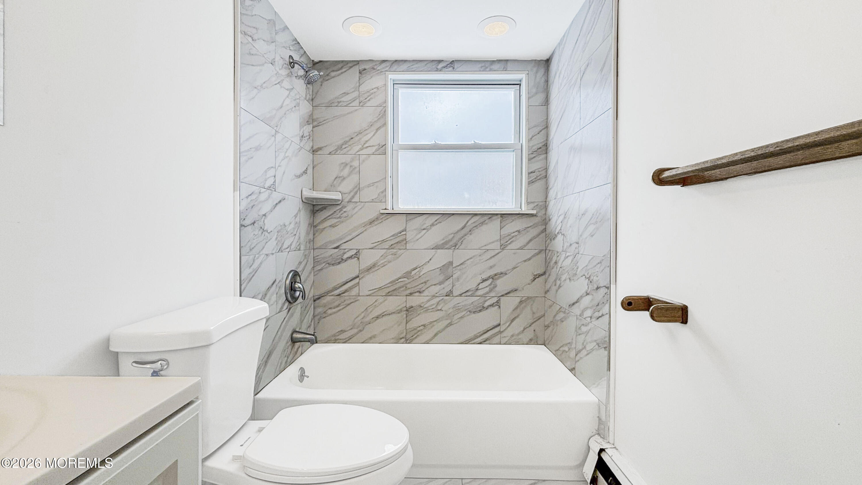 385 Delaware Drive Brick, NJ 08723 - Photo 10 of 16 a white toilet sitting next to a bath tub