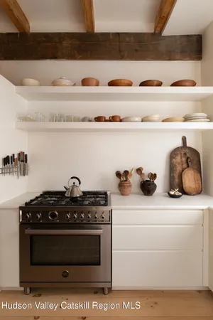 a bath tub sitting in a bathroom next to a window