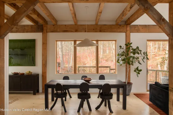 a view of a dining room with furniture and window