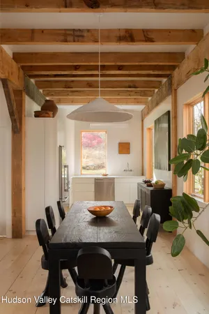 a kitchen with a sink appliances cabinets and a window