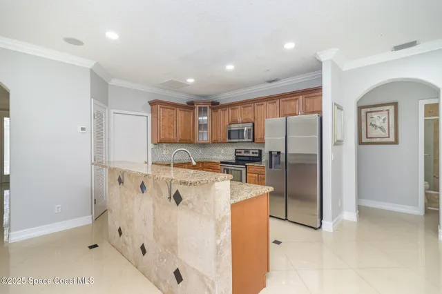 a spacious bathroom with a granite countertop sink a mirror and a vanity