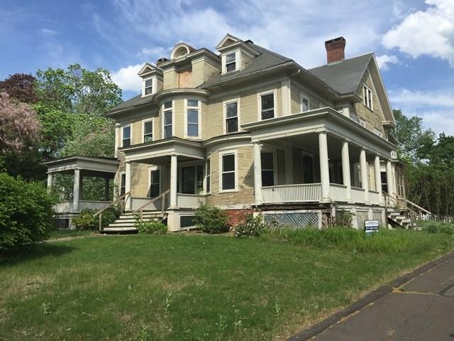 34 South Main Street Suffield, CT 06078 - Photo 1 of 1 a front view of a house with a yard