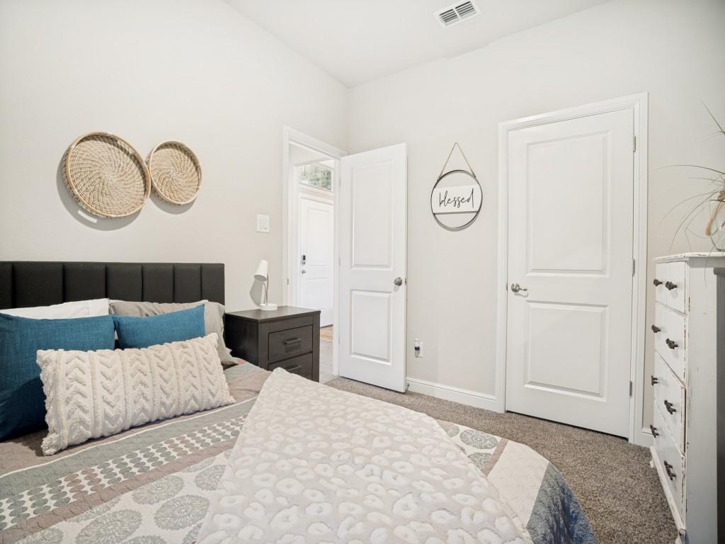 1612 Reed Drive Krum, TX 76249 - Photo 20 of 25 Bedroom featuring light-toned walls and plush carpeting