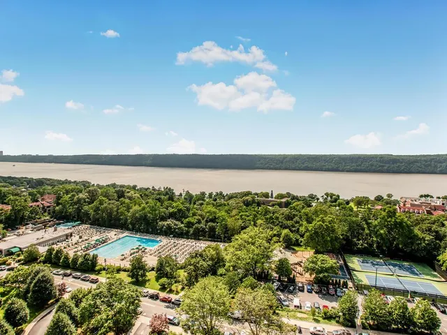a view of a lake with houses in the back