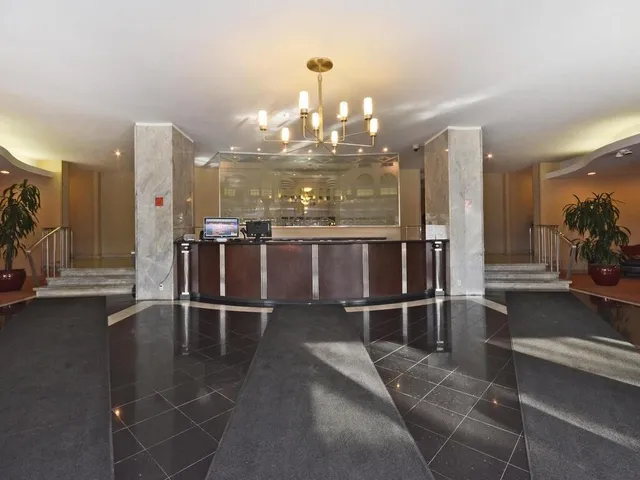 a view of a living room and chandelier