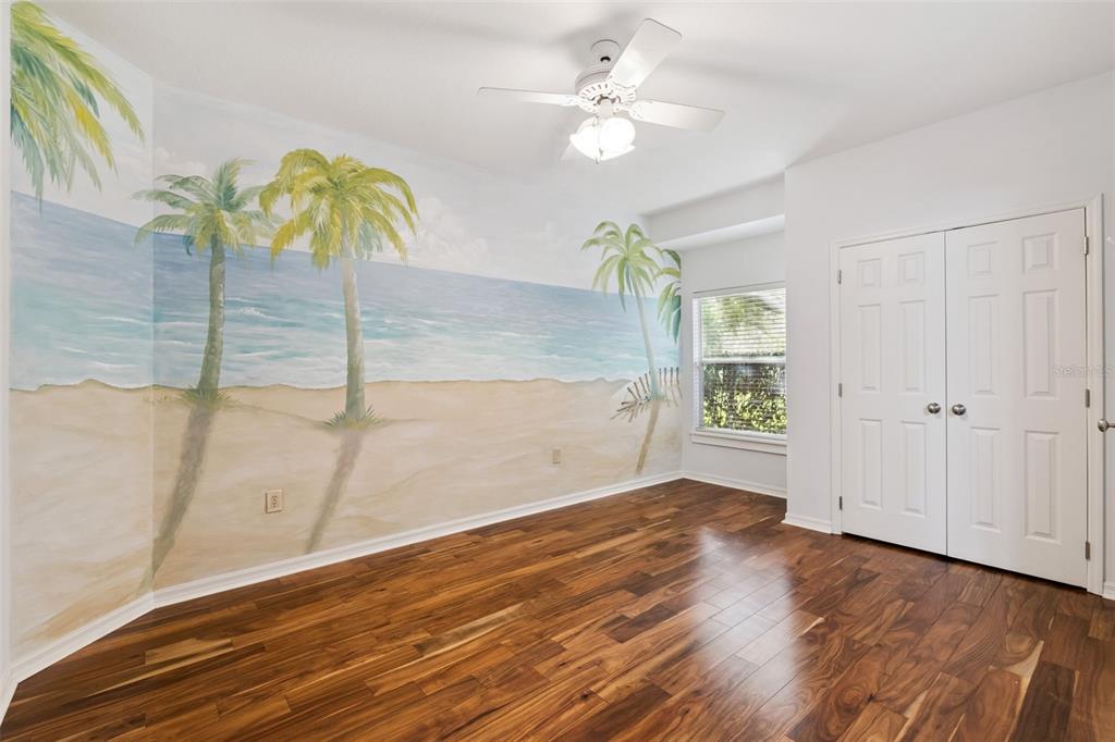2125 Kane Park Way Windermere, FL 34786 - Photo 29 of 63 an empty room with wooden floor and chandelier fan