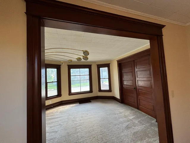 a view of an empty room with a window