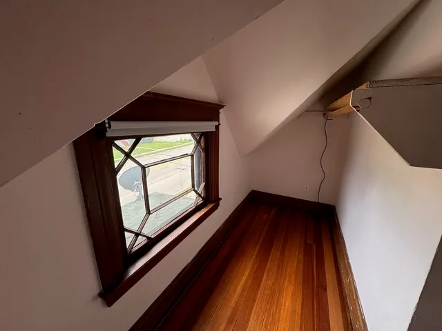 a view of staircase with wooden floor