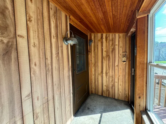 a view of a bathroom with a shower and curtain