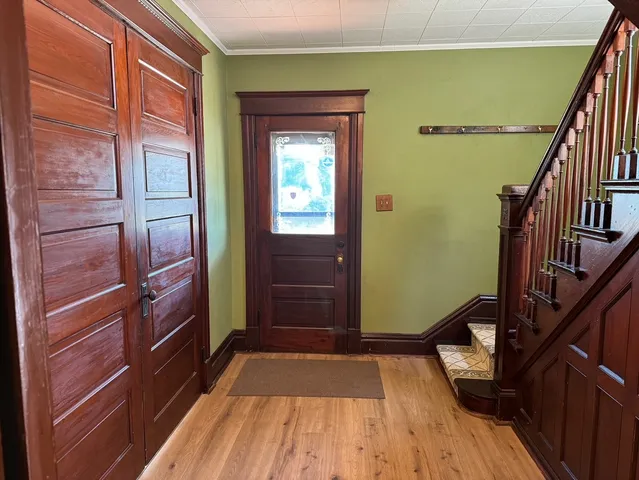 a view of stairs and wooden floor