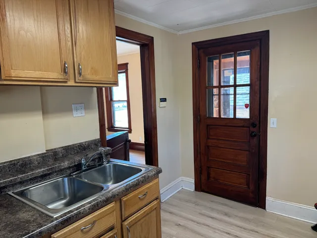 a kitchen that has a sink and cabinets