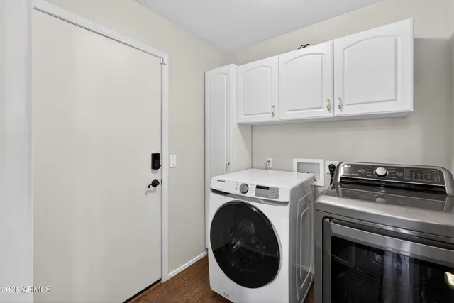 a utility room with dryer and washer