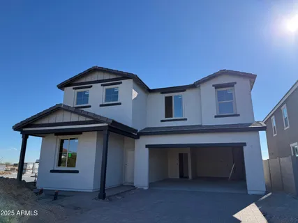 a front view of a house with garage