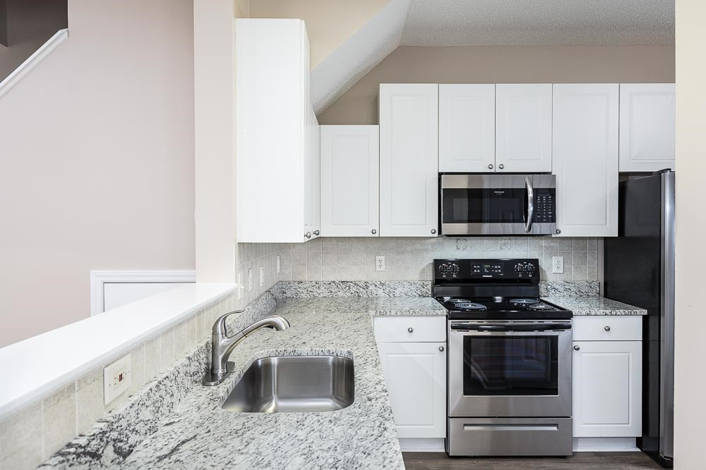 2044 Persimmon Ridge Drive Raleigh, NC 27604 - Photo 4 of 30 Stunning new granite counters and stainless range, microwave & dishwasher! Pantry, coat closet, and garage around the corner! Kitchen