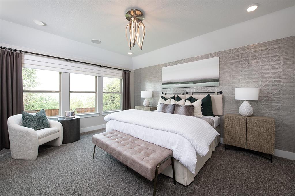 2216 Shady Elm Road Midlothian, TX 76065 - Photo 2 of 16 a spacious bedroom with a bed and a couch