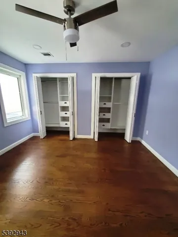 a view of an empty room with a closet